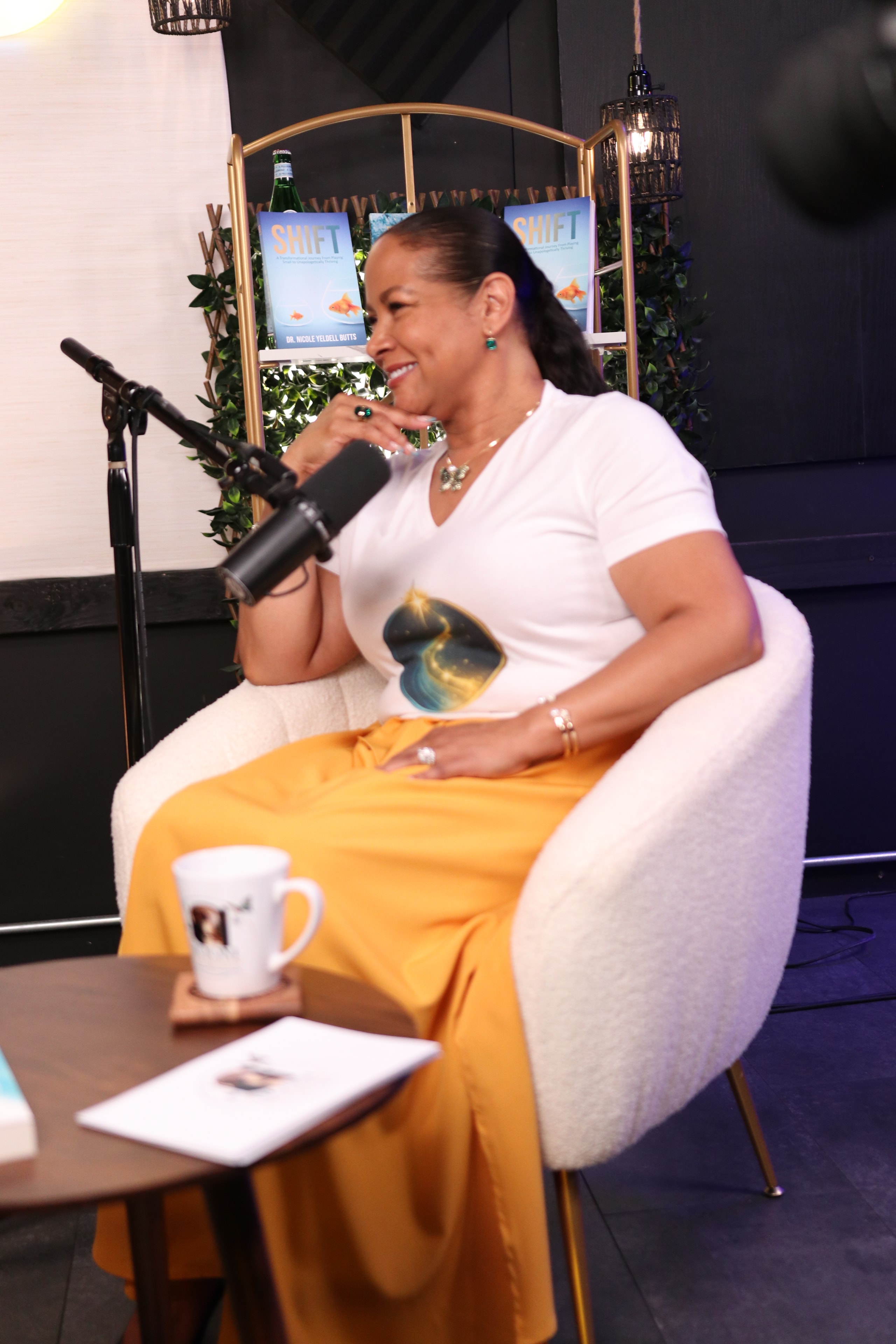 Dr. Nicole Butts recording The Room Between podcast on set