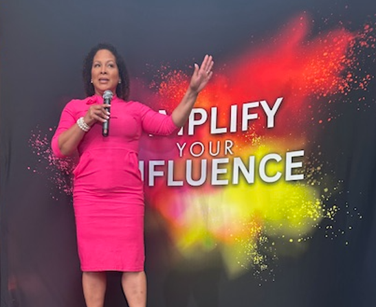 Dr. Nicole Butts speaking at the Amplify Your Influence event